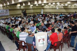 توزيع 400 طرد غذائي في البيرة بالتعاون مع IHH-001