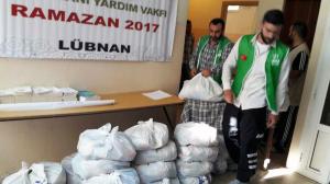 توزيع 400 طرد غذائي في البيرة بالتعاون مع IHH-004